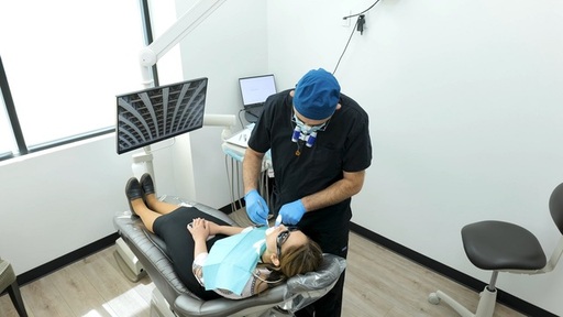 Denver dentist Dr. Katanov performing dental impla